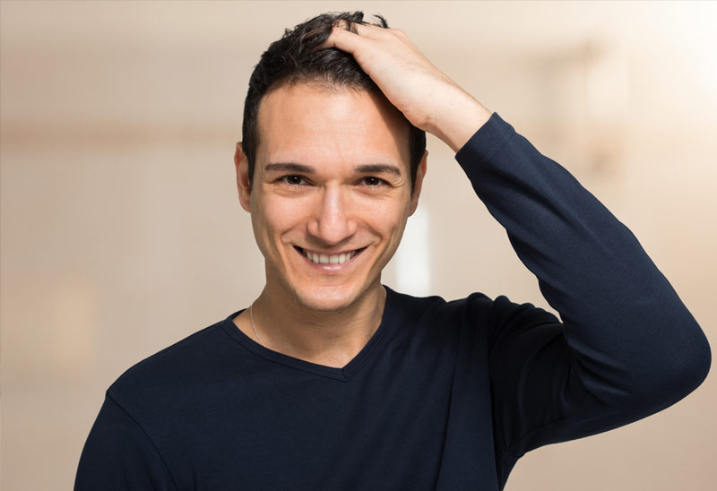 What factors contribute to the costs associated with getting a hair transplant?
